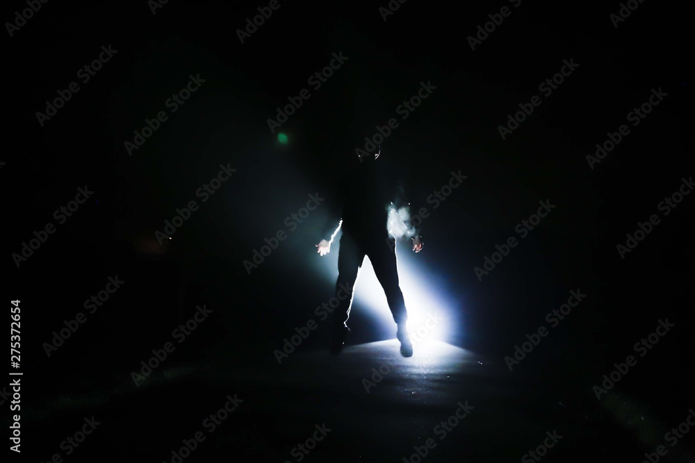 silhouette of a man with light backlight silhouette of a man with light backlight