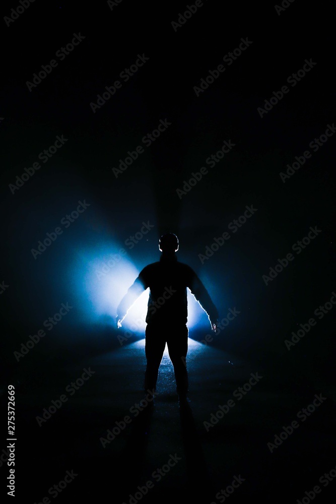 silhouette of a man with light backlight silhouette of a man with light backlight