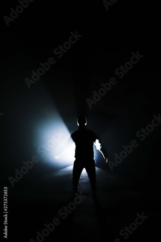silhouette of a man with light backlight