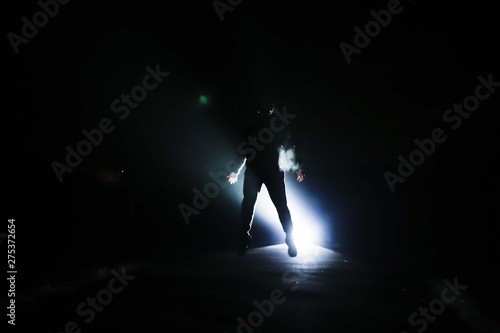 silhouette of a man with light backlight