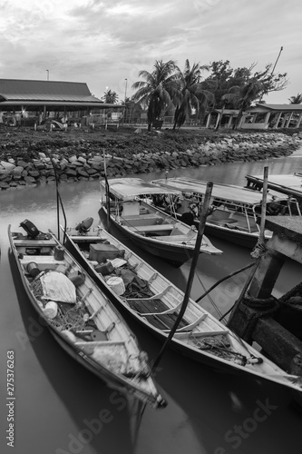 sunrise and the boat at the beach in black and white