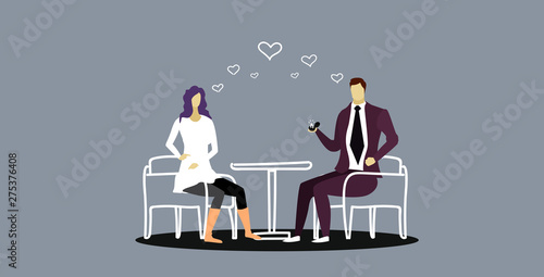 Man holding engagement ring proposing to woman