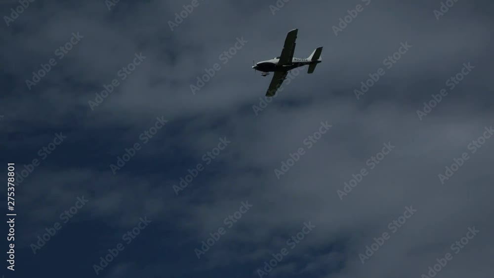 Airplane with propeller flying by. Low in the sky. Aircraft spotting in a blue sky. Airplane with propeller flying by. Low in the sky. Aircraft spotting in a blue sky.
