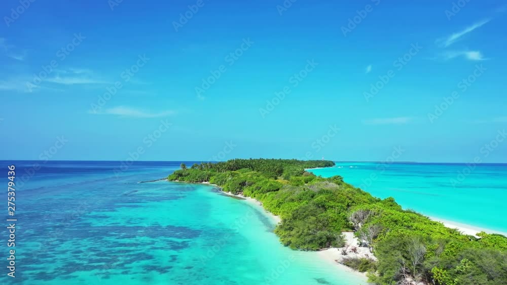 Drone flying over a tropical deserted island in Thailand, totally covered by a palm trees forest and with white sand beaches Drone flying over a tropical deserted island in Thailand, totally covered by a palm trees forest and with white sand beaches