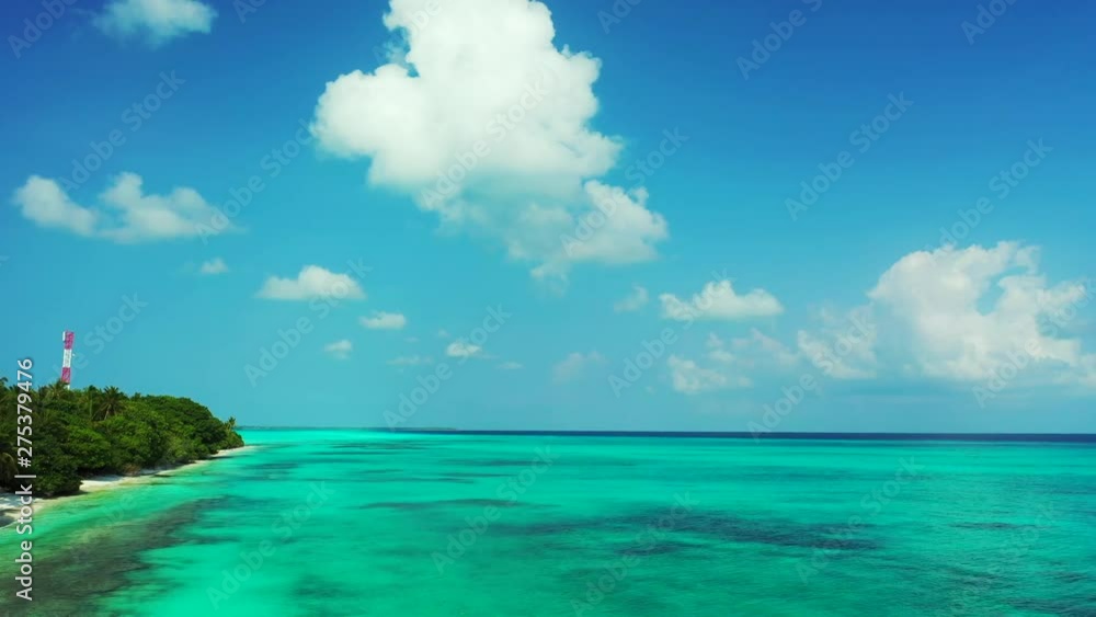 drone flying above the waters off the shore of a tropical island in Thailand, with white sand beach and azure transparent waters drone flying above the waters off the shore of a tropical island in Thailand, with white sand beach and azure transparent waters