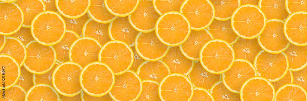 Fototapeta Pattern of orange citrus slices. Citrus flat lay
