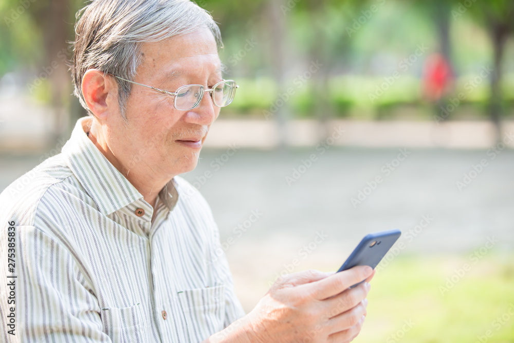 Older man use cellphone Older man use cellphone