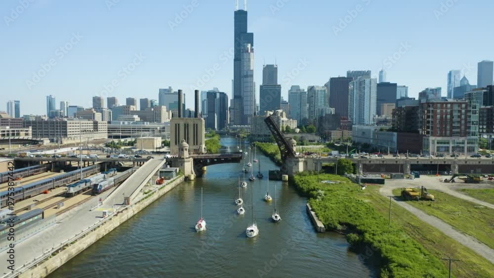 Static Aerial View of Boats Passing under Bridge Static Aerial View of Boats Passing under Bridge