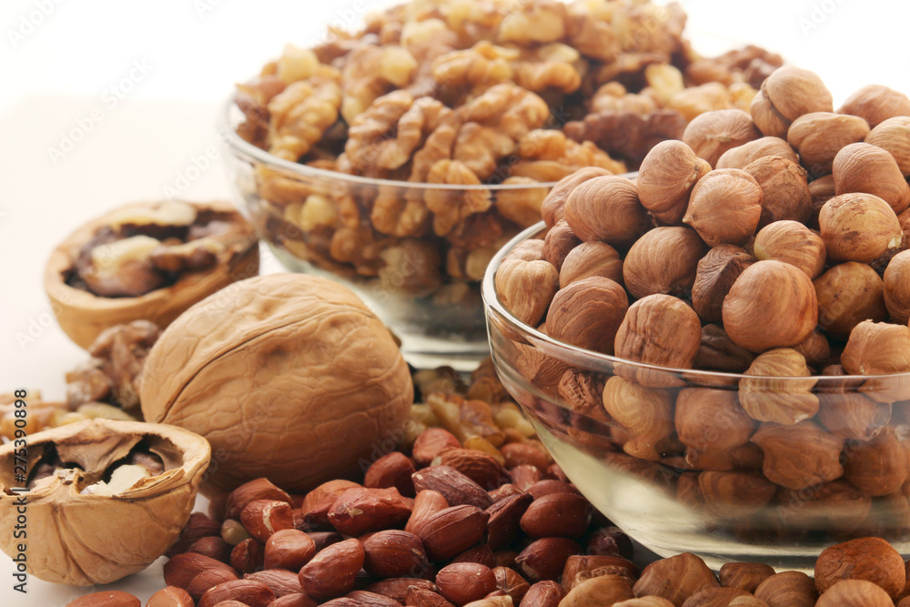 Different nuts in glass cups Different nuts in glass cups