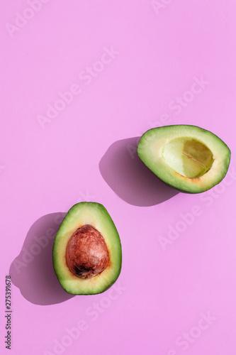 sliced ​​avacado on a pink background