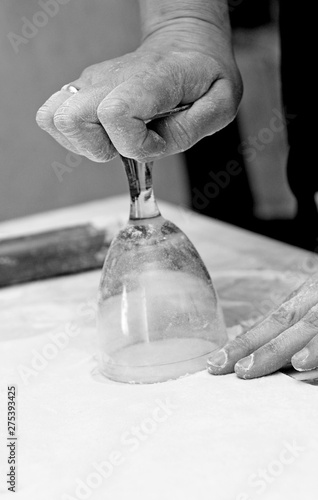 Women's hands make a glass of juicy dumplings