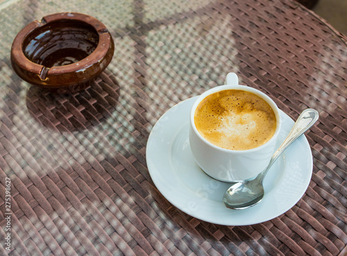 morning coffee and ashtray are on the table