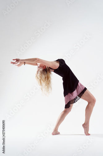 Photo of young blonde dancing in empty studio