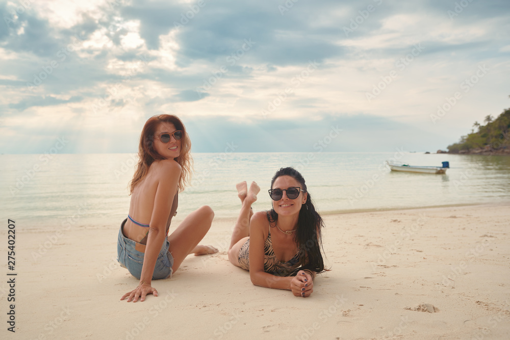 Lovers young couple of girls. On the beach . Concept of LGBT Lovers young couple of girls. On the beach . Concept of LGBT