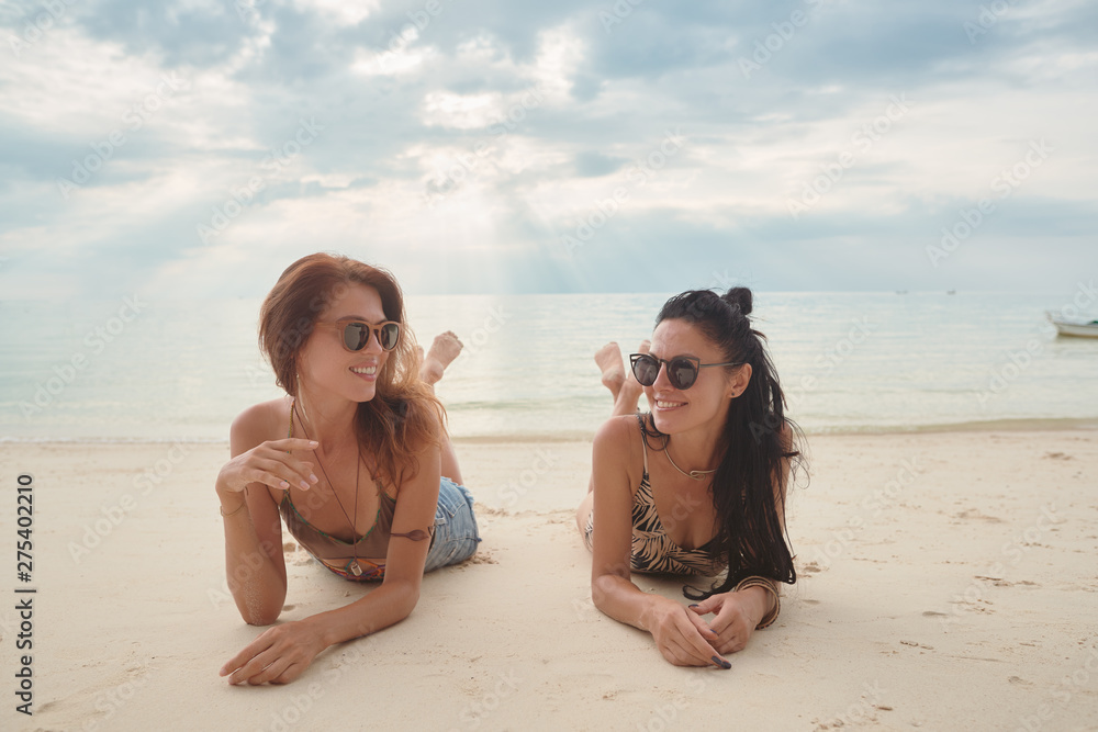 Fototapeta premium Lovers young couple of girls. On the beach . Concept of LGBT