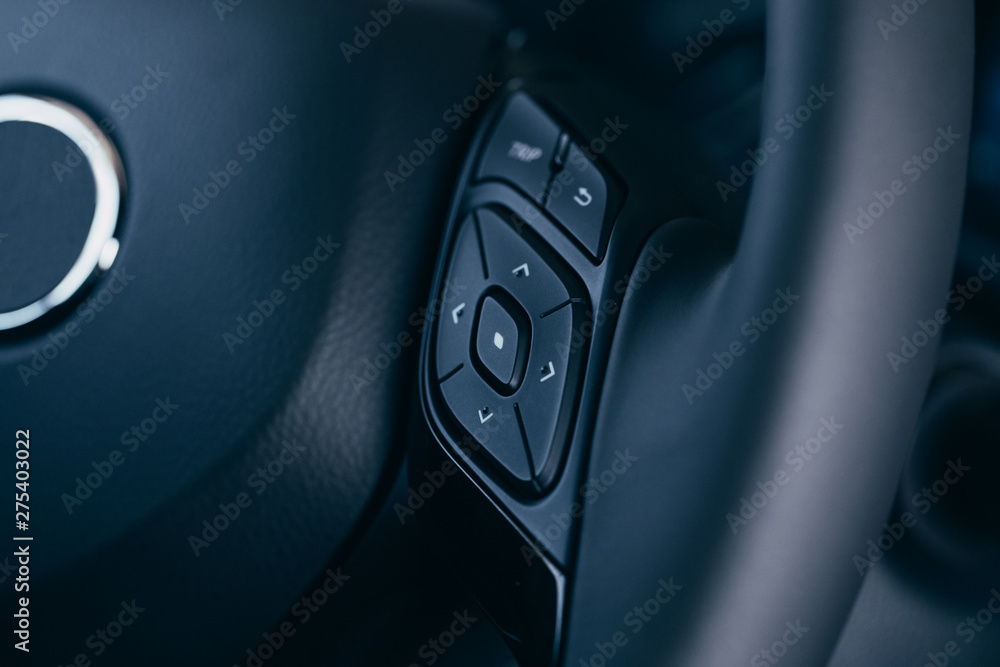 Audio control buttons on the steering wheel of a modern car Audio control buttons on the steering wheel of a modern car