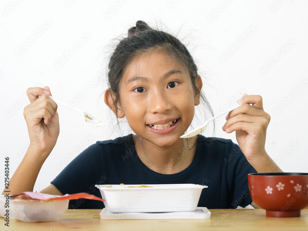 Asian girl eating spaghetti food box from convenient store, modern lifestyle concept. Asian girl eating spaghetti food box from convenient store, modern lifestyle concept.
