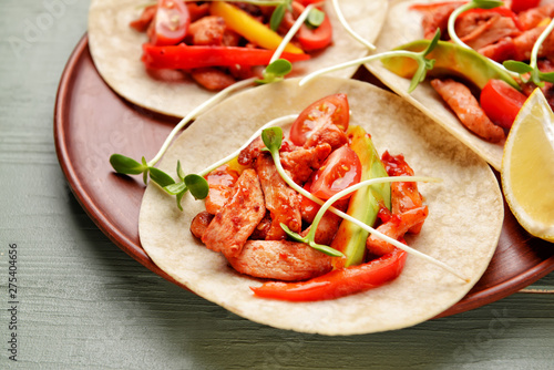 Tasty fresh tacos on plate, closeup