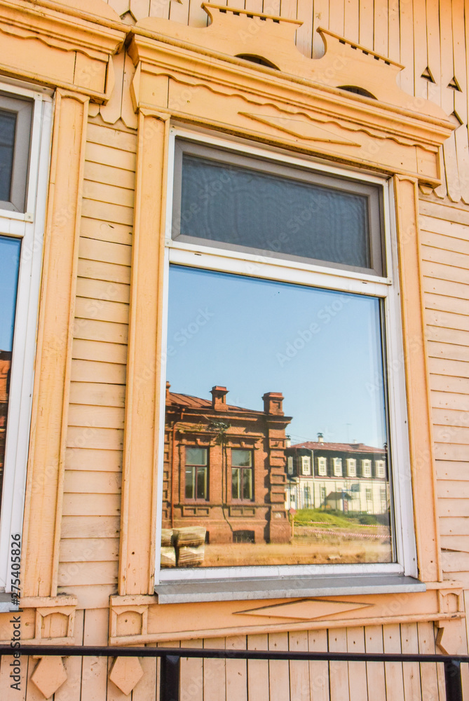 Fototapeta premium Wooden Windows in old houses in the Russian North. Nice shots. Carving. Traditional wood housing