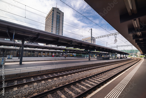 Perspective View of Railway Platform and Rail Track, Passengers and Exchange Station of Swiss Transit Train, Europe Public Rail Pass, Travel Switzerland