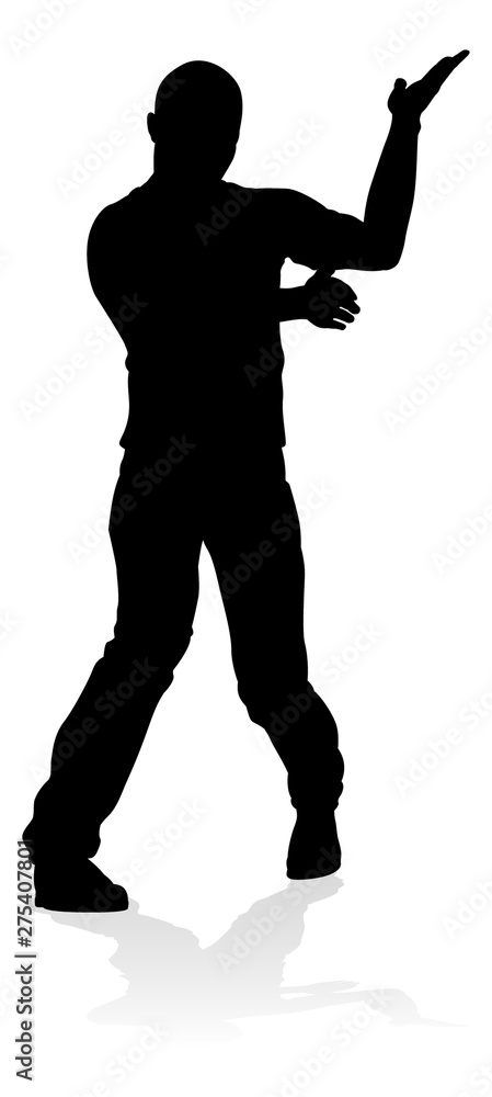 A male street dance hip hop dancer in silhouette