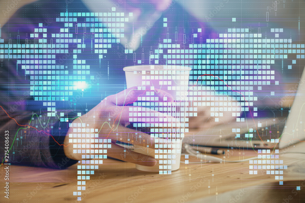 Double exposure of businessman working on laptop on background. International business hologram in front. Concept of success. Double exposure of businessman working on laptop on background. International business hologram in front. Concept of success.