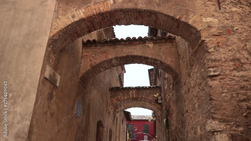 old arches made of bricks, ancient architecture in Sirmione (Italy) old arches made of bricks, ancient architecture in Sirmione (Italy)