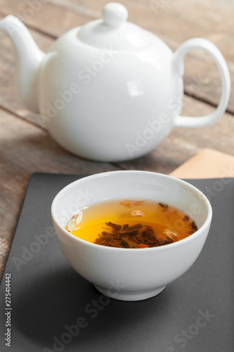 herbal tea in cups on a wooden background