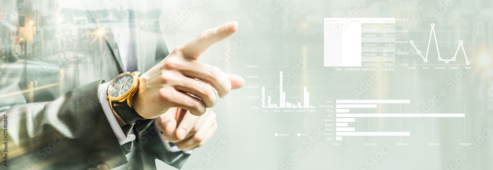 people, business and gesture concept - close up of man pointing finger to to somethingBusinessman Touching a Graph above a City people, business and gesture concept - close up of man pointing finger to to somethingBusinessman Touching a Graph above a City