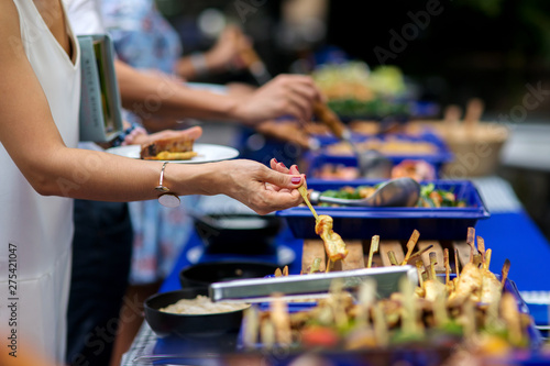 Fotografie people group in the line catering buffet food indoor in luxury restaurant with m