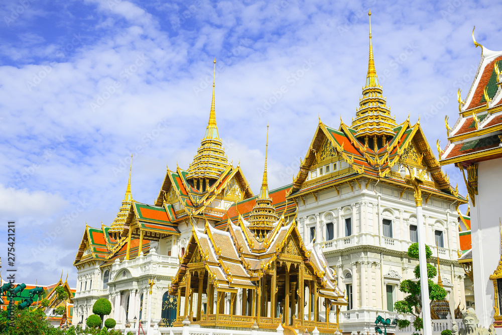 Fototapeta premium Wat Phrakeaw or Wat Phra Si Rattana Satsadaram,The beautiful of the pagoda and blue sky,The temple in the Grand Palace Area,Bangkok,Thailand.