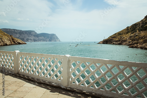 the Bay of Balaklava and the Ruins of Genoese fortress Cembalo. Balaklava  Crimea. People admire the sea