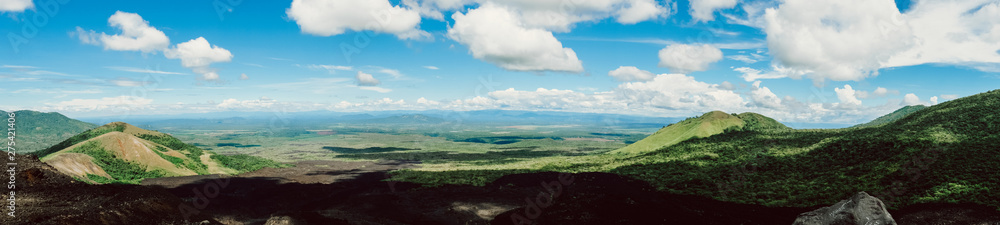 Nicaragua. Cerro Negro. Panorama of volcanoes on the background of bright blue sky