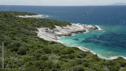 Rising over island forest to reveal coastline of Proizd Island, Croatia 4k photo