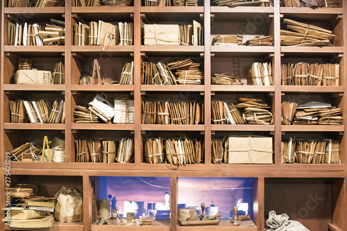 Stack of old letters on a wooden bookcase. Old mail of the post office