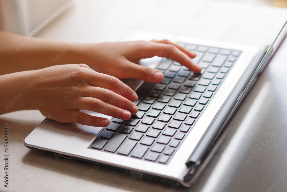 Woman working at home office hand on keyboard close up Woman working at home office hand on keyboard close up