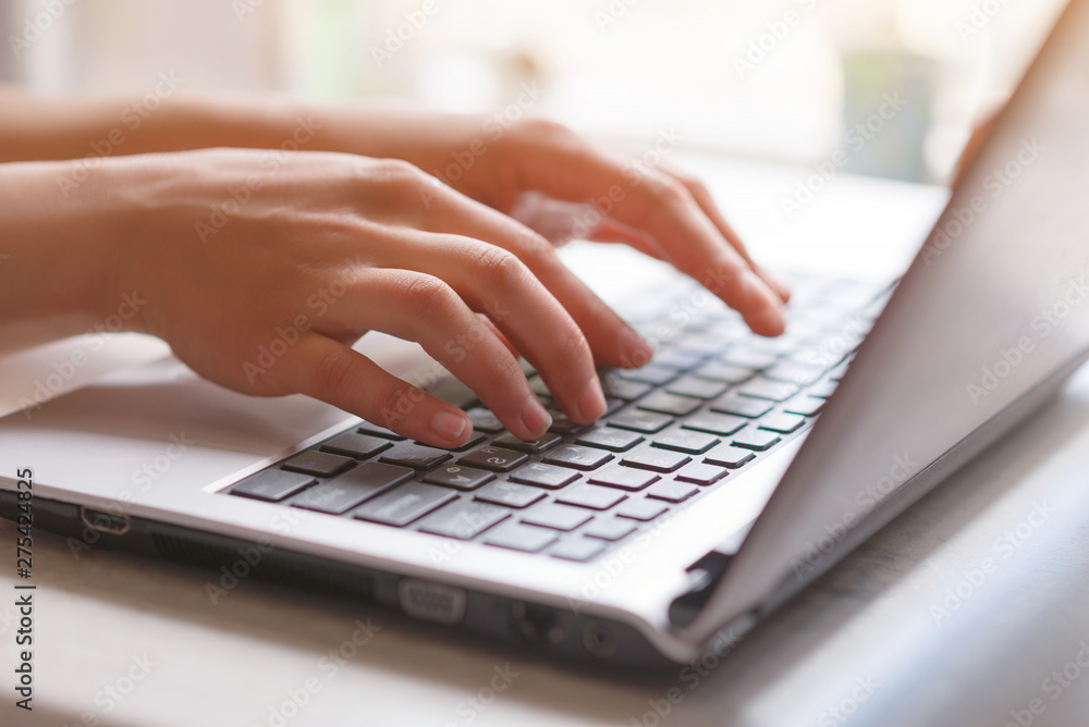 Woman working at home office hand on keyboard close up Woman working at home office hand on keyboard close up