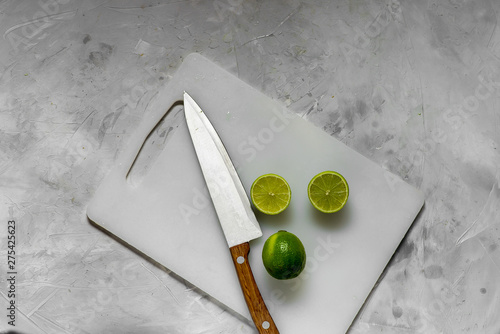slices of fresh green lime on the kitchen light board.