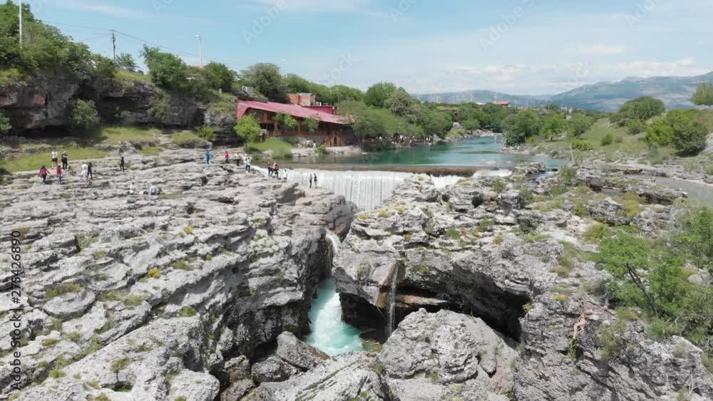 Montenegro, Turquoise clean clear river cijevna near podgorica at niagara falls flowing through beautiful green rocky nature landscape Montenegro, Turquoise clean clear river cijevna near podgorica at niagara falls flowing through beautiful green rocky nature landscape
