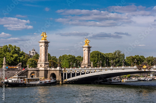 France, 8th arrondissement of Paris, Pont Alexandre III over the Seine river and barges photo