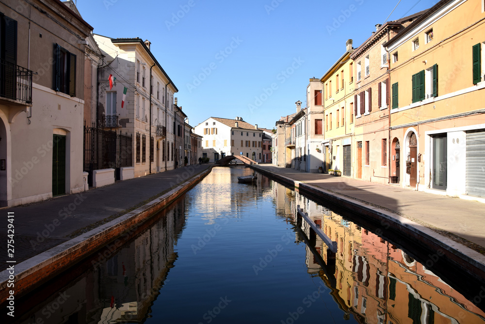Ancient lagoon houses on the canal in the center of the town of Comacchio