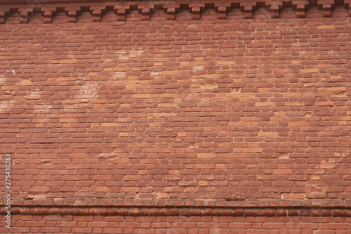 red brick wall texture grunge background with vignetted corners 