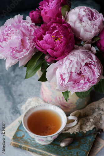 Cup of tea with peonies