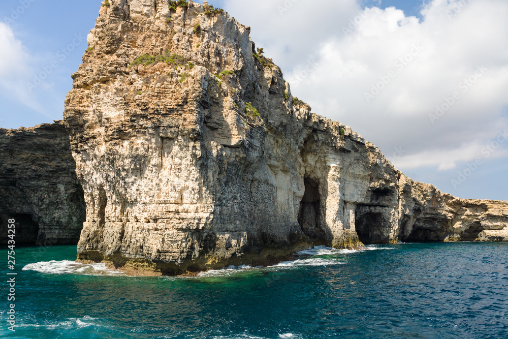 Sea and caves near Ahrax Point, Mellieha, island Comino, Malta