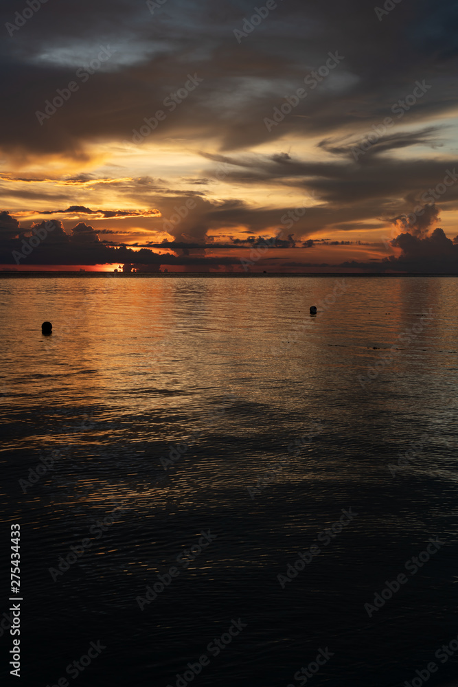 Beautiful dark colorful sky at sunset vivid colors over ocean to horizon in Sabah Borneo.