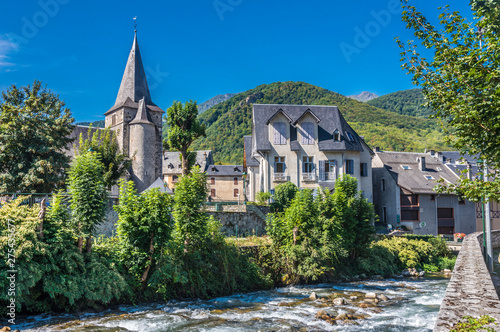 France, Hautes-Pyrenees, vallee d'Aure, Arreau, church Notre-Dame and house of Jean Feraud on the bank of the Neste river of Louron (Saint James way) photo