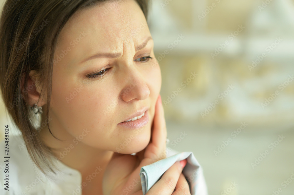 Close up portrait of young crying woman posing at home Close up portrait of young crying woman posing at home