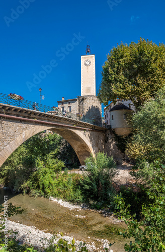 France, Drome, The Provencal Baronnies Regional Natural Park, Mollans-sur-Ouveze, arch bridge on the Ouveze river, belfry and chapel Notre Dame de la Compassion (18th century) photo