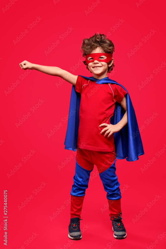 Cheerful superhero in heroic pose Cheerful superhero in heroic pose