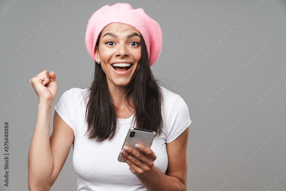Attractive young brunette woman wearing beret standing Attractive young brunette woman wearing beret standing